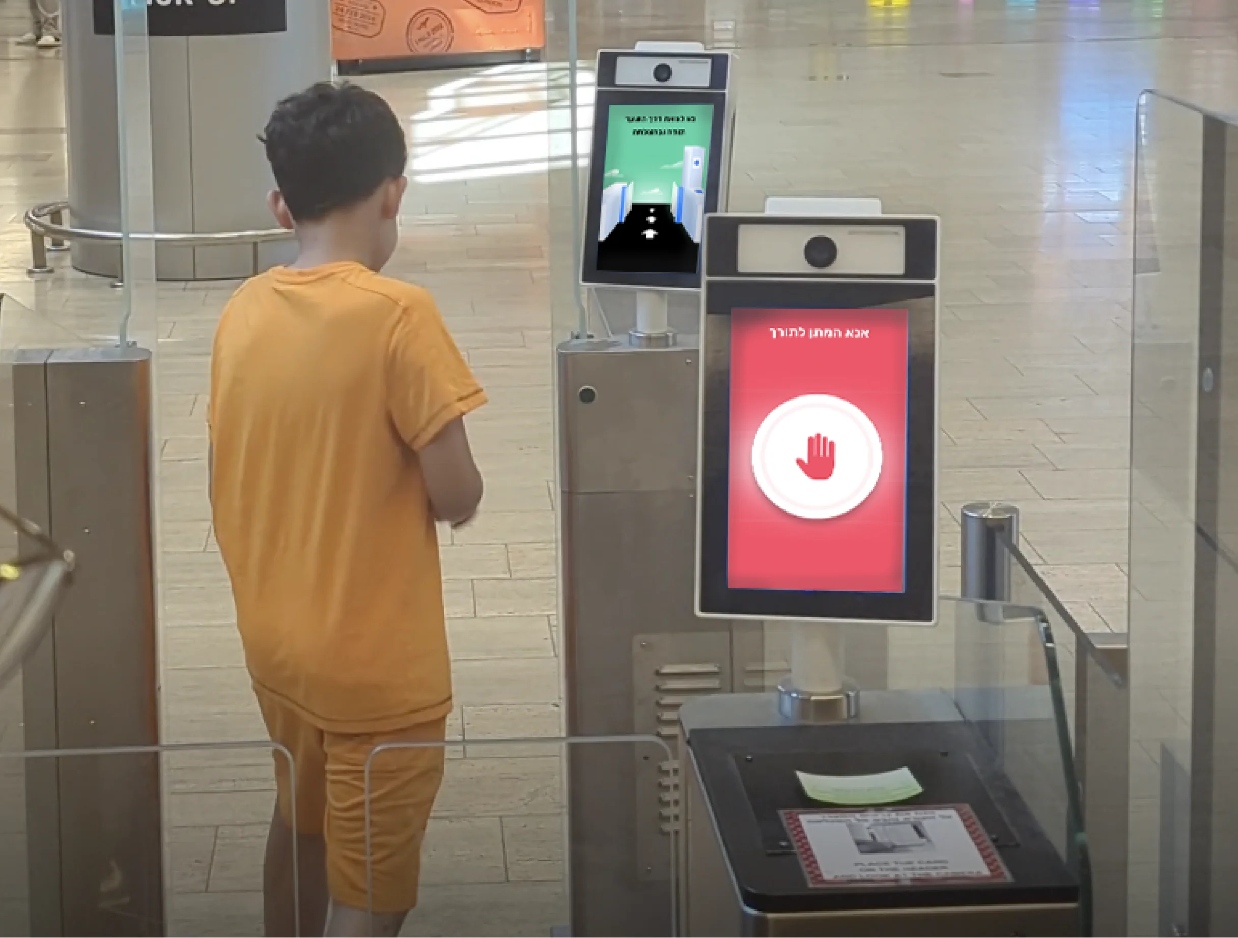 A boy walking up to a double gate with the new step-by-step screens